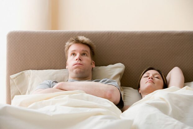 man and woman in bedroom